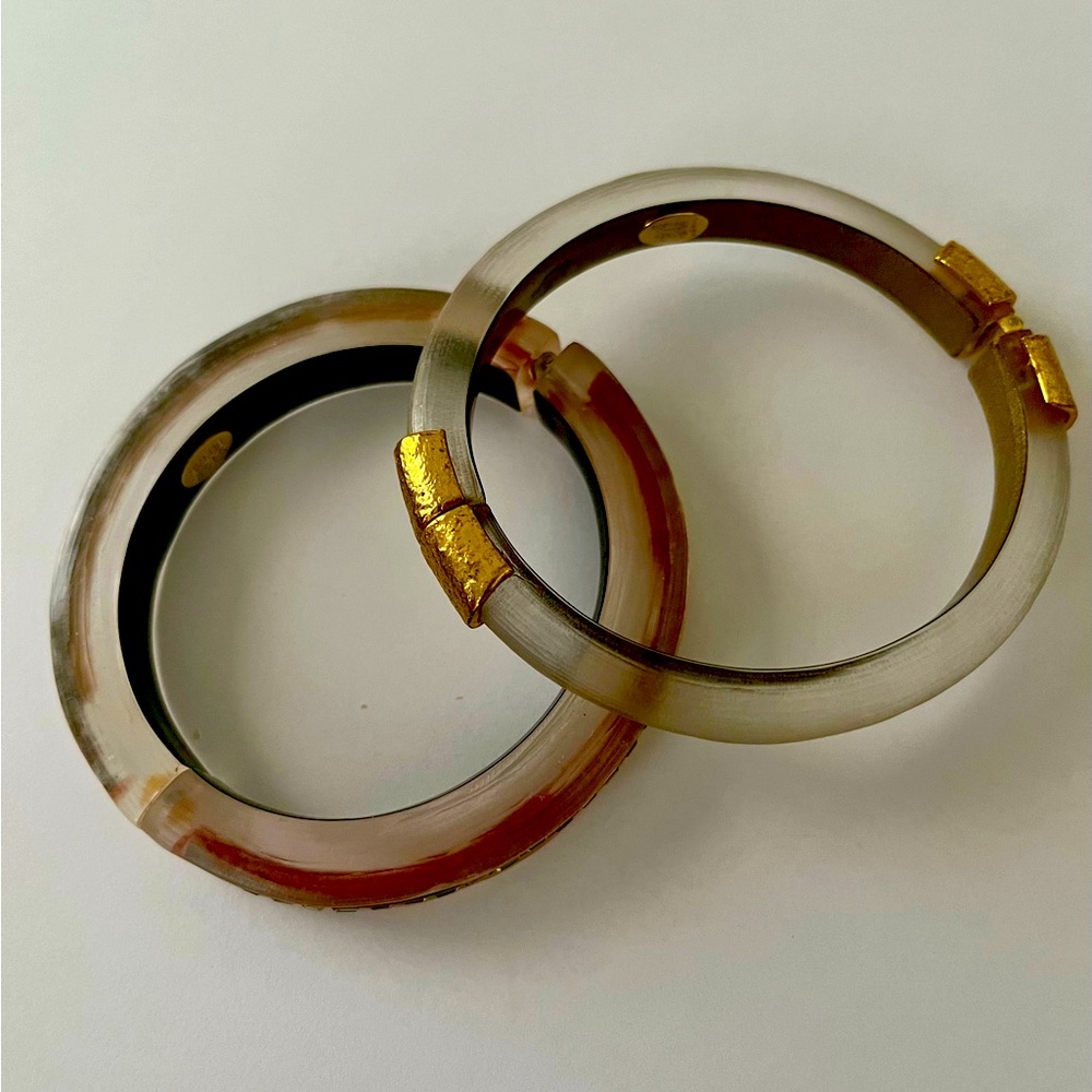A pair of signed Alexis Bittar lucite bracelets